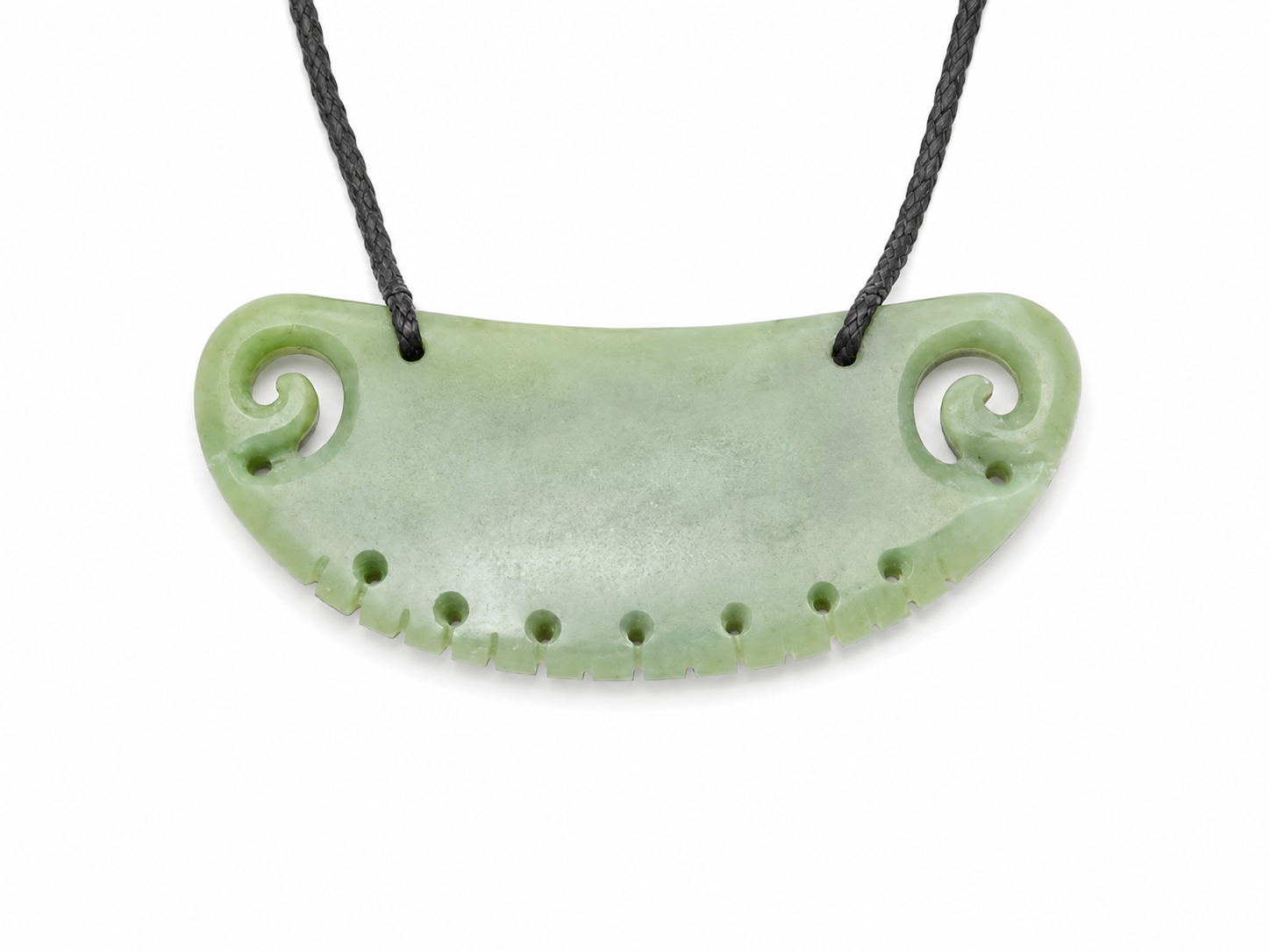 A light green carved stone pendant necklace with a curved, semi-circular shape, featuring spiral details on both ends and a row of small holes along the bottom edge, suspended from a black cord against a white background.