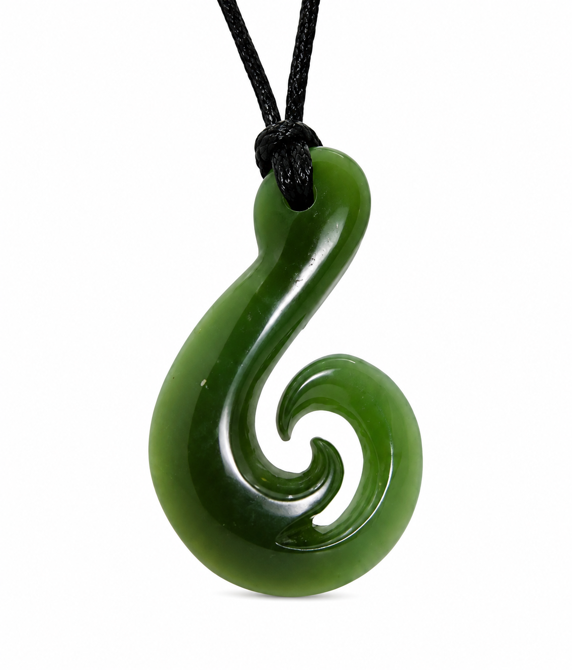 A green carved pendant necklace with a black cord, featuring a curved, spiral design resembling a koru or whakato shape, shown against a plain white background.