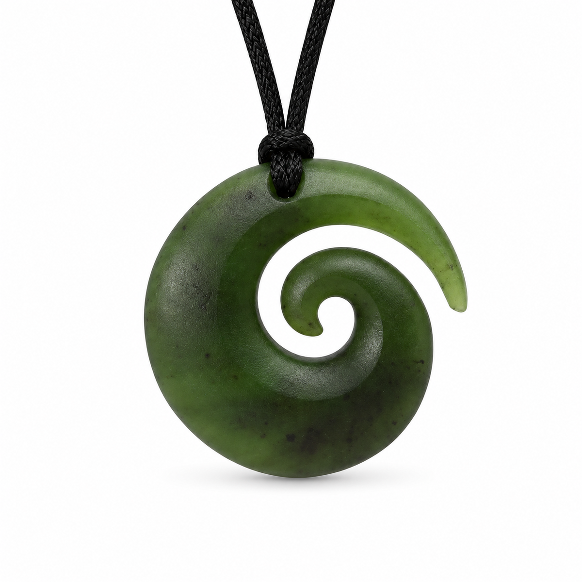 A green carved stone pendant necklace with a spiral design, suspended from a black cord on a white background.