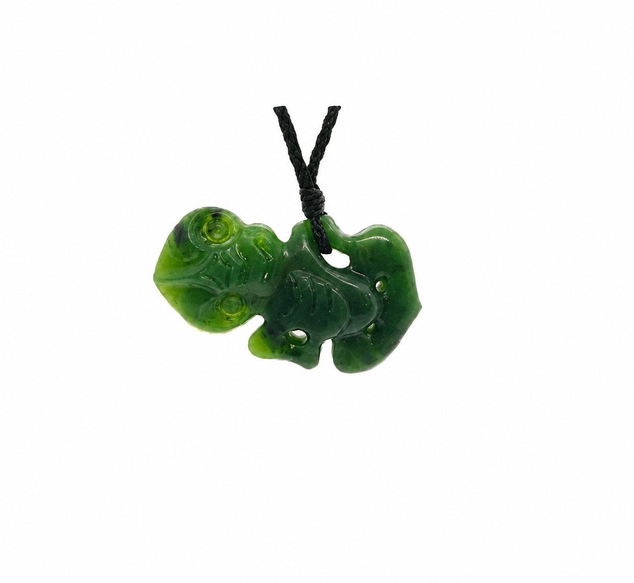 A carved green jade pendant with a tiki design, hanging from a black cord, shown against a plain white background.