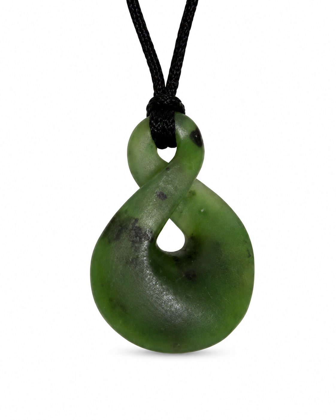 A green carved pendant necklace on a black cord, photographed against a plain white background.